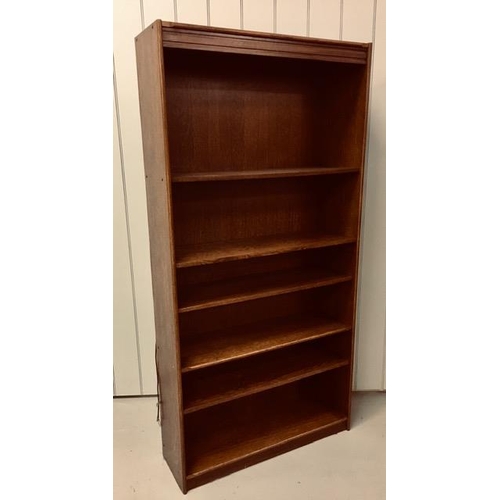 31 - An oak veneer, tall open bookcase, with five adjustable shelves. Dimensions(cm) H180, W80, D53.