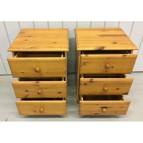 67 - A pair of pine coloured bedside chests of three drawers. Dimensions(cm) H69, W45, D46.