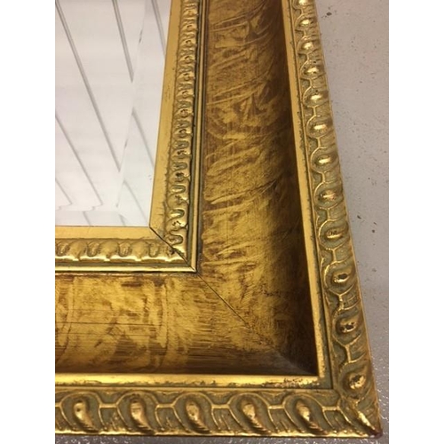 77 - A stunning, contemporary mantle mirror, with patterned gilding & bevelled-edged glass. May be hung v... 