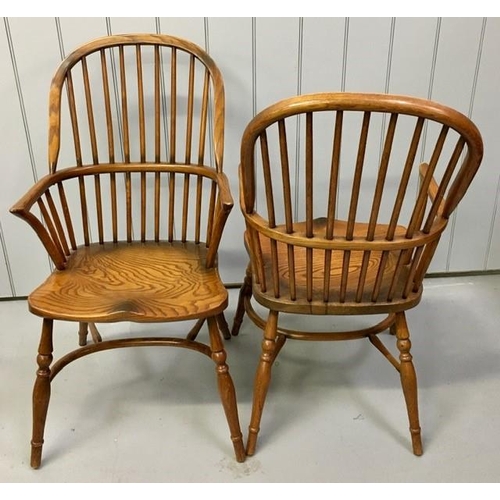 107 - A set of four, dark elm hoop-backed, Windsor armchairs. Dimensions(cm) H103(47 to seat), W53, D62.