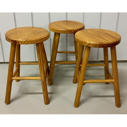 118 - A set of three pine stools. Dimensions(cm) H46, W29, D29.