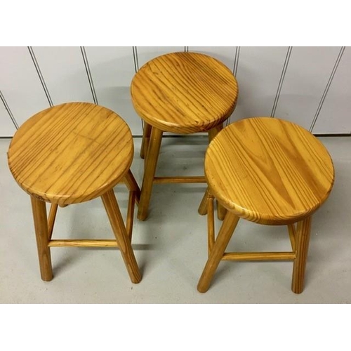 118 - A set of three pine stools. Dimensions(cm) H46, W29, D29.