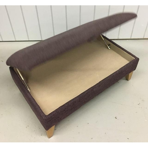 123 - An aubergine fabric lounge ottoman footstall, with a hinged top & beech-coloured feet. Dimensions(cm... 