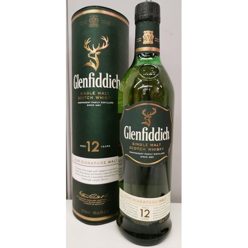 245B - A 1 litre bottle of twelve years old Glenfiddich single malt Whisky, with presentation box.