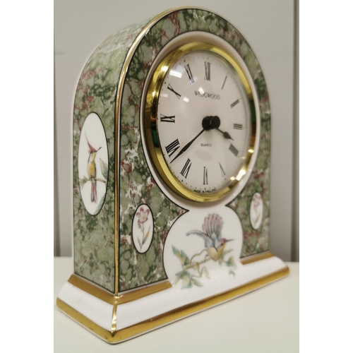 384 - A Wedgwood 'Humming Birds' mantel clock. Dimensions(cm) H12, W11, D4.