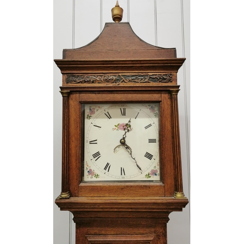 388 - An oak cased grandfather clock, with key present. Vendor advises clock is in in good working order &... 