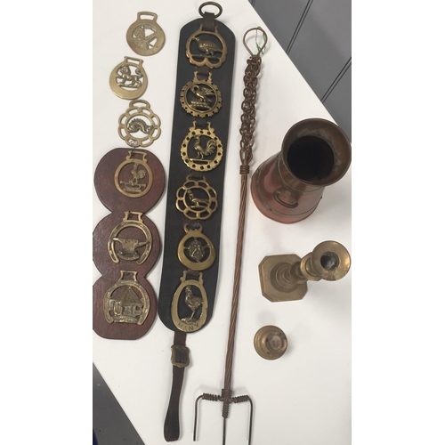 455 - A collection of horse brasses, together with a toasting fork copper jug & brass candlestick.