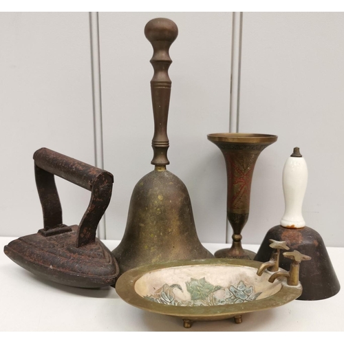 423 - A mixed lot of antique metal ware. To include two hand bells, flat iron, soap dish & candleholder. T... 