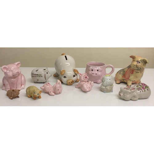 492 - A collection of eleven ceramic pigs. To include money boxes, mugs etc.