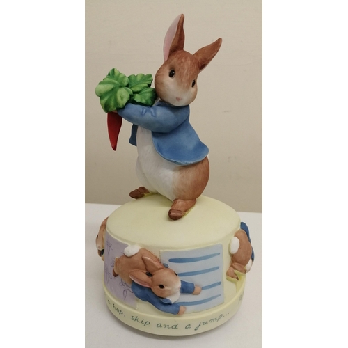 496 - A boxed 'Border fine Arts - The Peter Rabbit Collection' revolving musical 'Peter Rabbit With A Hop'... 