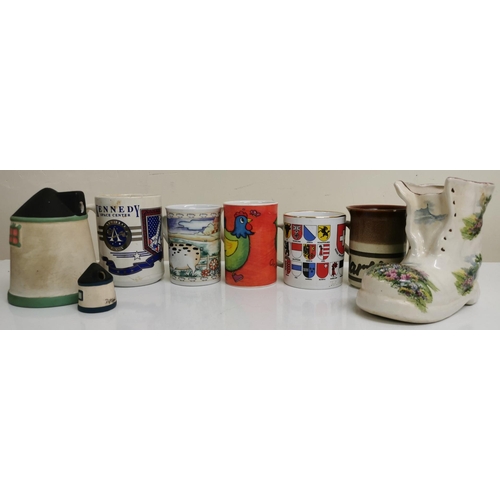 544 - A selection of eight ceramic items. To include tourist mugs, decorative boot planter & two tealight ... 