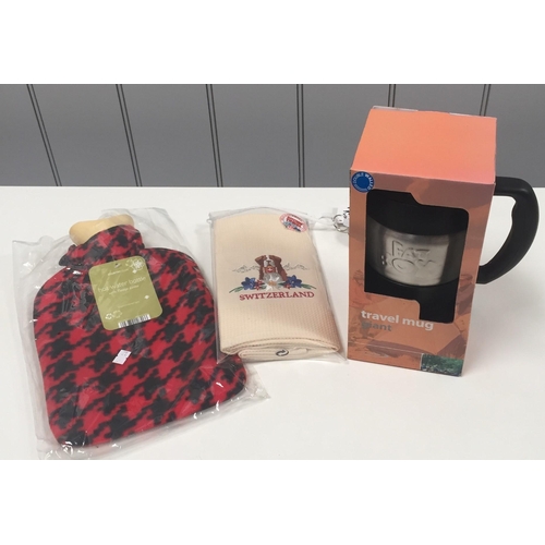 643 - A new/boxed travel mug, unopened hot water bottle & an unopened souvenir kitchen towel.