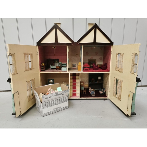 765 - A stunning, handmade dolls house c.1950's. Fully furnished with mid-century styling. Includes a larg... 