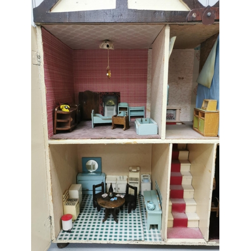 765 - A stunning, handmade dolls house c.1950's. Fully furnished with mid-century styling. Includes a larg... 