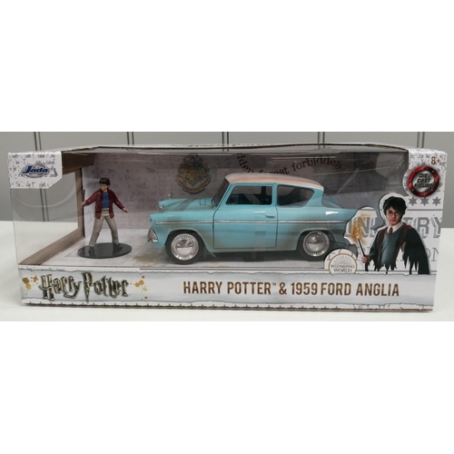 A boxed, 'Jada' Harry Potter & 1959 Ford Anglia set. Includes diecast vehicle & figure.