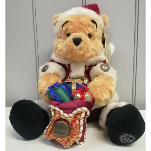 A limited edition Father Christmas Winnie The Pooh plush toy with tag & certificate of authenticity, from the Disney Store 2006. Limited edition 5,861/7,000. Height 30cm.