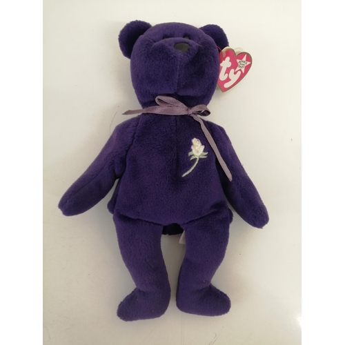 4087 - A purple 'TY Beanie Baby - Princess' bear, with tags, produced in memory of Princess Diana. Tag has ... 