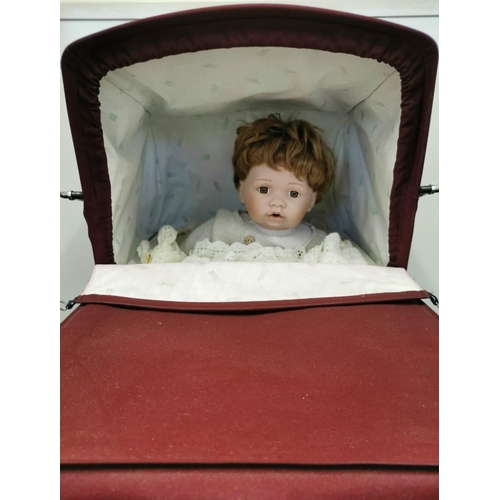 4088A - A beautiful burgundy Silver Cross doll's pram with matching bag, complete with Silver Cross pram bed... 