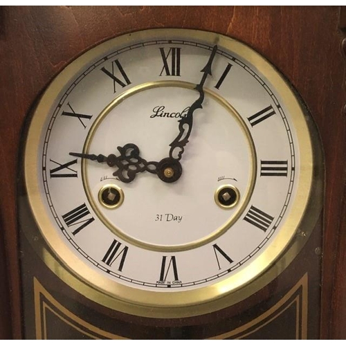 386 - A 31-day pendulum wall clock, by 'Lincoln'. Key present. Untested. Dimensions(cm) H64, W28, D16.