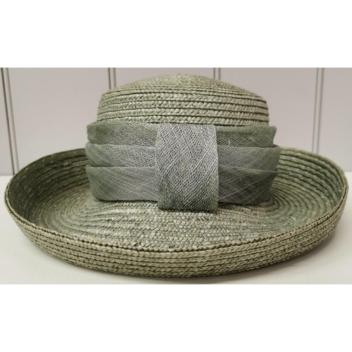 712 - A duo of ladies' formal straw hats, by 'HatBox'. To include brown & green examples, together with a ... 