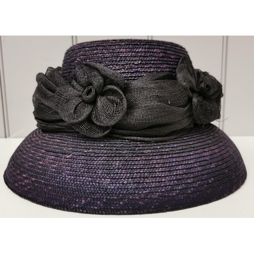 714 - A duo of ladies' formal straw hats, in navy blue, by HatBox (flowers) & Debut (feathers), together w... 