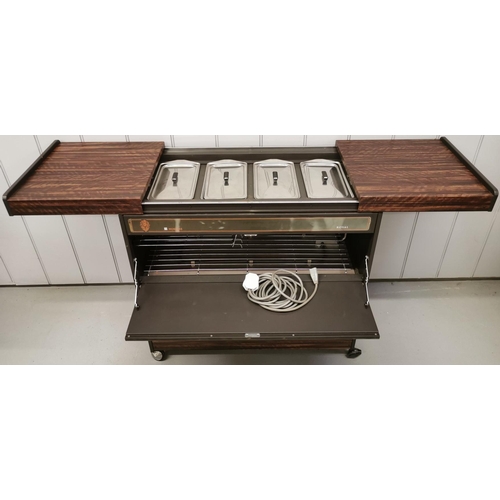 780 - An 'Ekco Royal HO31' heated hostess trolley, with four stainless steel lidded food compartments. On ... 