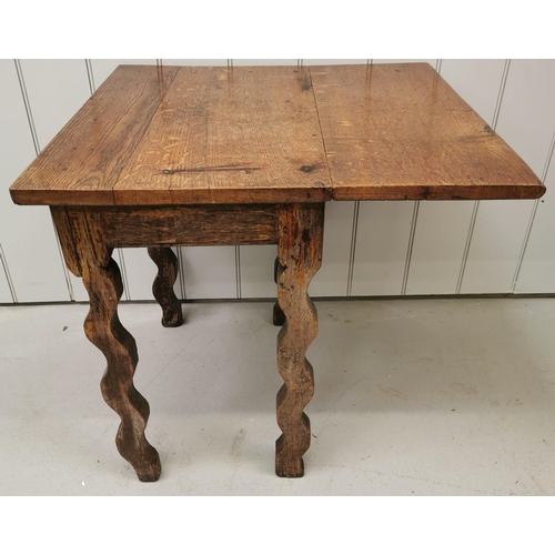 972 - An antique oak, single drop-leaf table, with wavy legs. Dimensions(cm) H64, W67/43, D65.