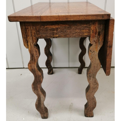 972 - An antique oak, single drop-leaf table, with wavy legs. Dimensions(cm) H64, W67/43, D65.