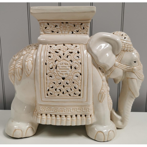 1390 - A large, ceramic elephant plant pot stand. White with cream detailing. Dimensions(cm) H43, L52, W24.