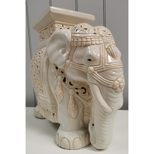 1390 - A large, ceramic elephant plant pot stand. White with cream detailing. Dimensions(cm) H43, L52, W24.