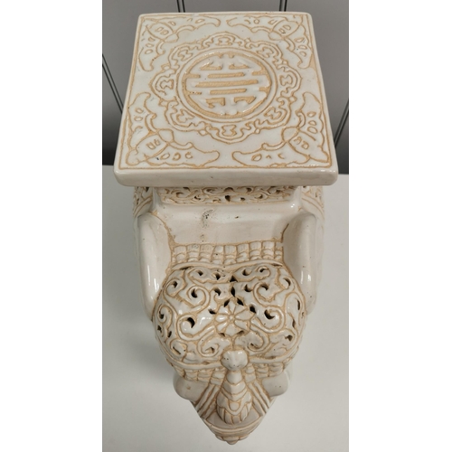 1390 - A large, ceramic elephant plant pot stand. White with cream detailing. Dimensions(cm) H43, L52, W24.