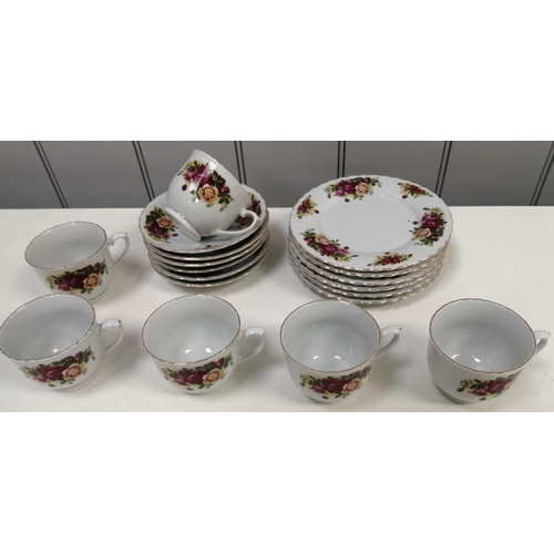 1369 - An eighteen-piece 'Royal Norfolk' country roses pattern tea set. To include six cups, saucers & side... 