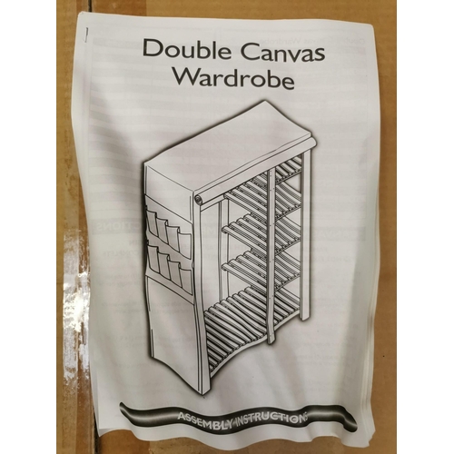 24 - A boxed, soft pine & cream canvas double wardrobe with instructions. Never assembled & box opened on... 