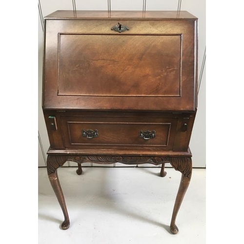 106 - An early 20th century, mahogany writing bureau. Fall-front reveals a leather writing insert & partia... 