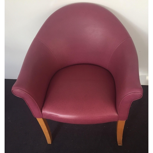 138 - A Parker Knoll mauve coloured tub chair (model P.K. 1184-7) with matching footstool (model P.K. 1240... 