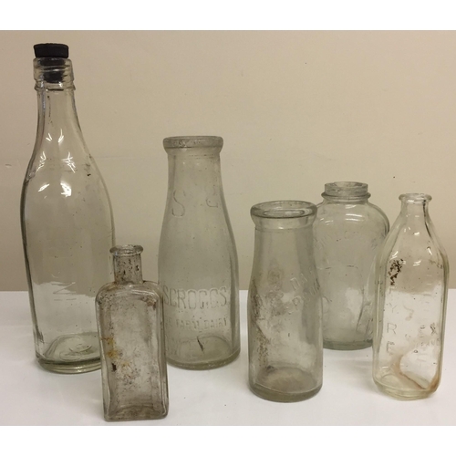 202 - A collection of vintage clear bottles (mostly trackside finds). To include Pyrex baby bottle, M62 Jo... 