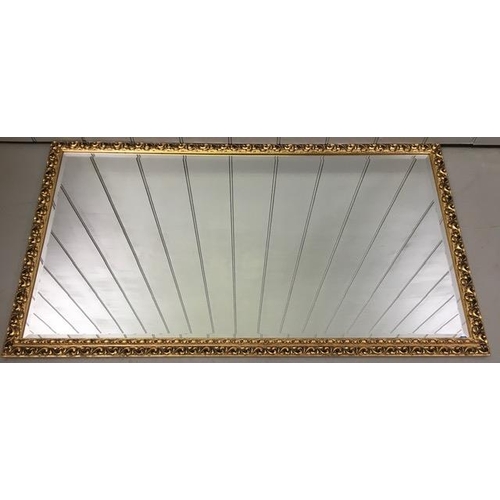 180 - A large, contemporary, bevelled-edged overmantle mirror, with a patterned gilt frame. Dimensions(cm)... 