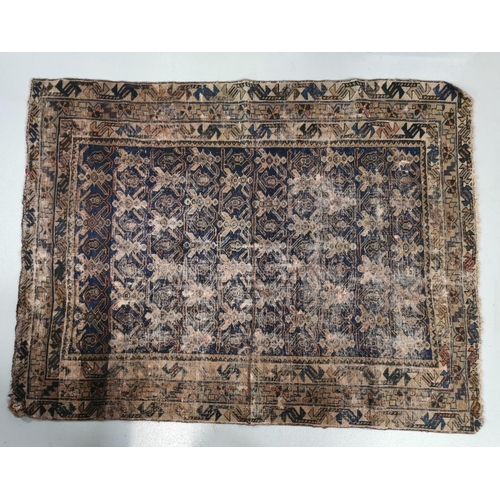 199A - A vintage rug, with Geometric Design. Primarily, blue in colour. Wear to centre.  Dimensions 156cm x... 