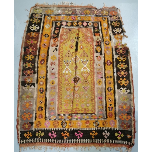 199H - A Moroccan Kelim rug, with a bright geometric pattern. Shows signs of wear. Dimensions 182cm x 138cm... 