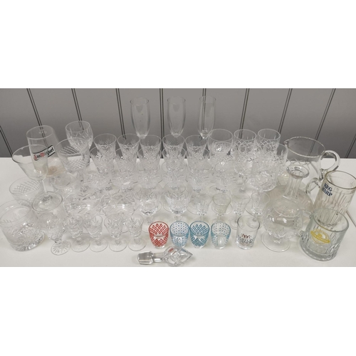 201 - A selection of fifty-eight items of mixed glassware. To include crystal & branded examples.