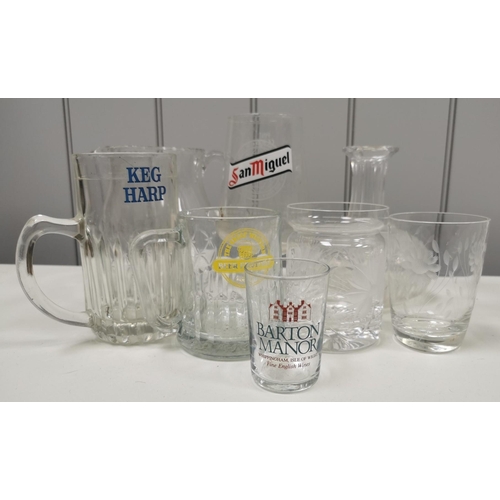 201 - A selection of fifty-eight items of mixed glassware. To include crystal & branded examples.