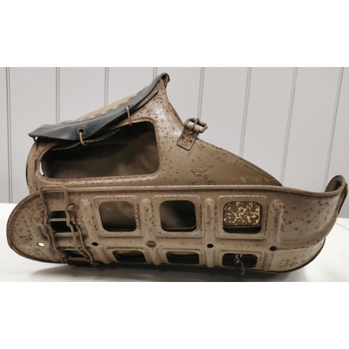 268 - A rare WWII child's gas mask. Showing signs of wear.