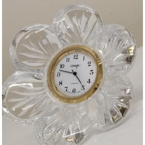 383 - A 'Tyrone Crystal' battery operated clock (10cm diameter) & a 'Concept' quartz flower-design table c... 