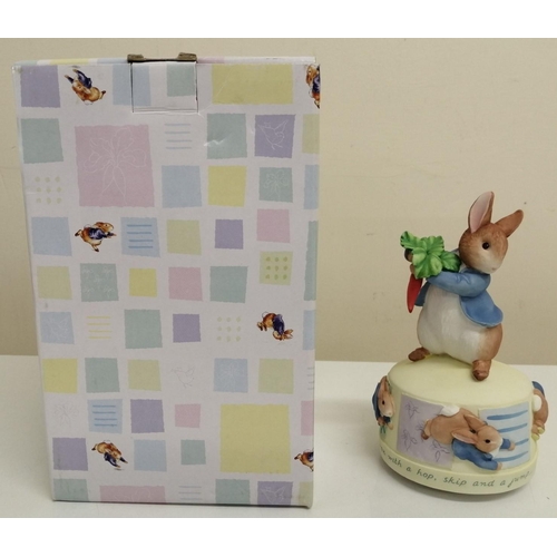 496 - A boxed 'Border fine Arts - The Peter Rabbit Collection' revolving musical 'Peter Rabbit With A Hop'... 