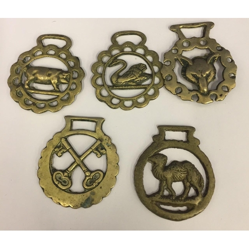 456 - A collection of five Horse Brasses.