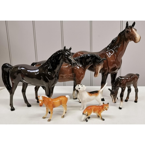 523 - A collection of seven ornamental figures, To include five horses, hunting dog & fox. Four horses & t... 