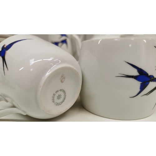 535 - A c.1930's Czechoslovakian tea set, with deep blue flying swallows design & gold-coloured detail. To... 