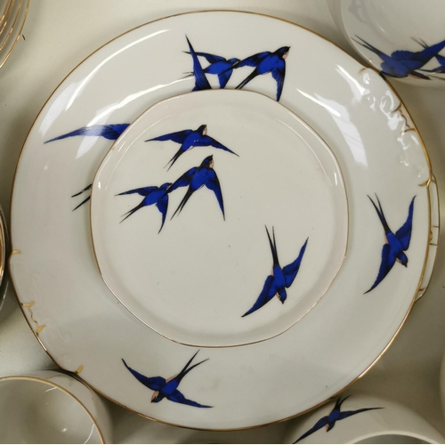 535 - A c.1930's Czechoslovakian tea set, with deep blue flying swallows design & gold-coloured detail. To... 