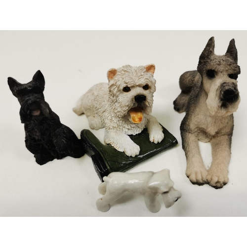 539 - A collection of eight ceramic dog figures.