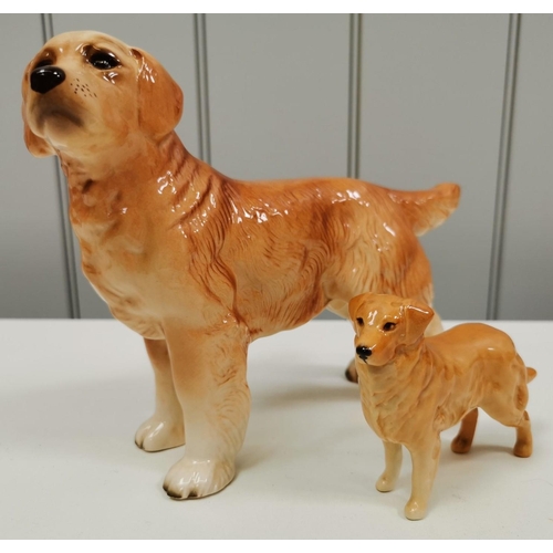 540 - Two ceramic dogs figures. The smaller being by 'Beswick' (with repair). Dimensions(cm) H17/8, W23/12... 